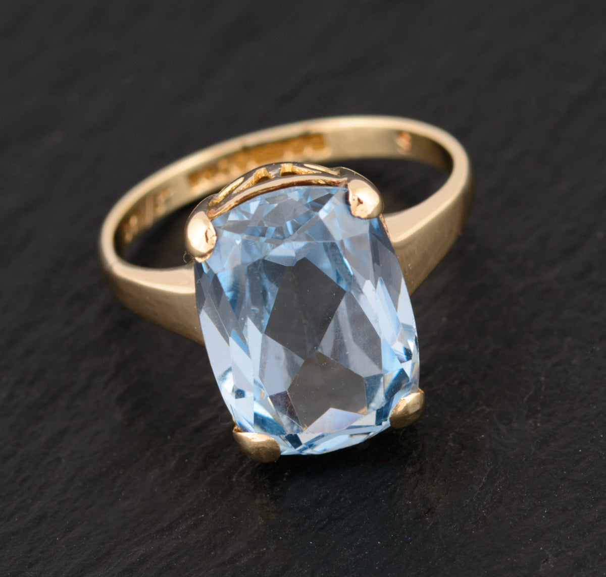 Gold ring with hot sale light blue stone